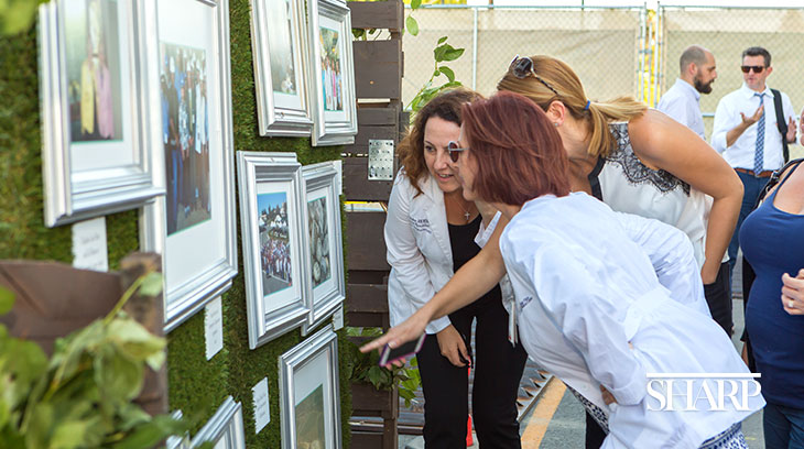 Hedges adorned with photos of the hospital’s 70-year history in the South Bay.